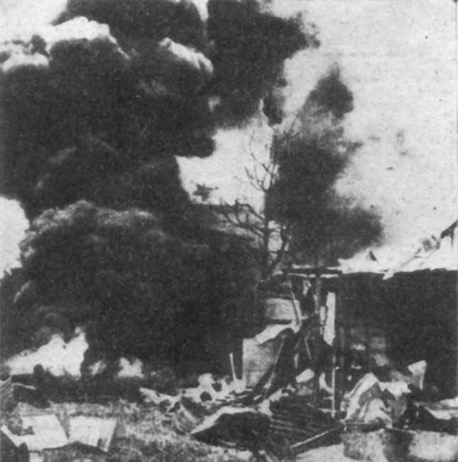 Guinea Airways hanger at Salamaua on fire