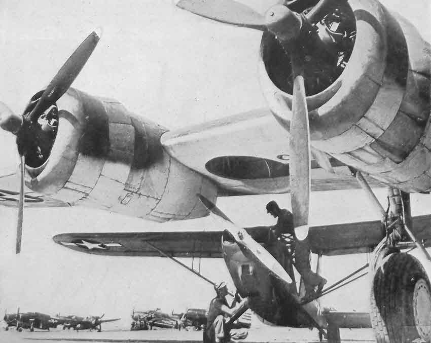 Stinson L-5 Sentinel under wing of Consolidated PB4Y-2 Privateer 