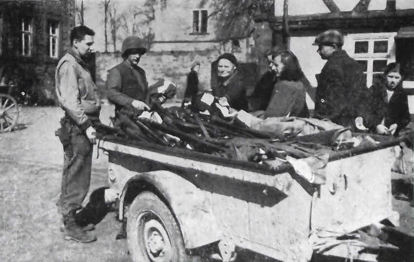 German weapons and Nazi flags being surrendered at Uslar 