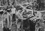 US troops moving 75mm shells, Mt Tambu, 1943 
