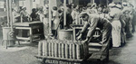 Cleaning up 25-pounder shell after filling 