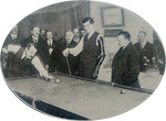 One-armed veterans playing billiards 